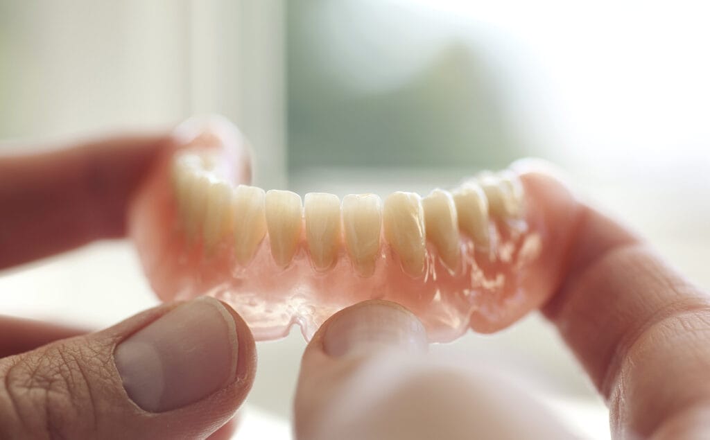 Dental technician working in dental laboratory