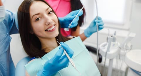 Lady in chair getting teeth done